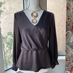 Exquisite  Banana Republic silk long sleeve peplum blouse.